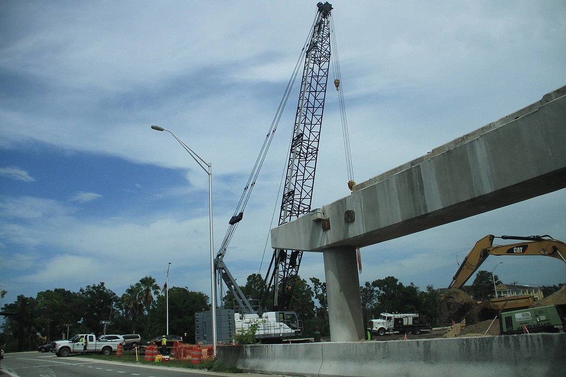 Workers remove the last of the old Port Orange bridge at Dunlawton and Taylor.