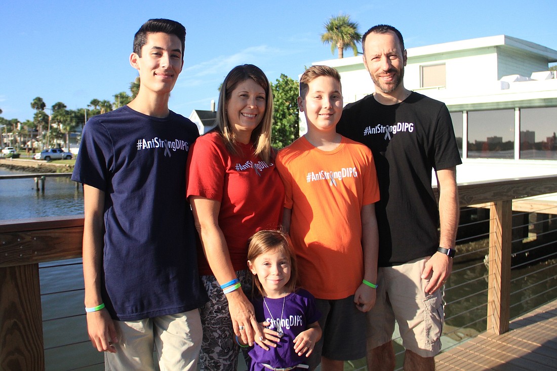 Anthony Franzini (orange shirt) and his family.
