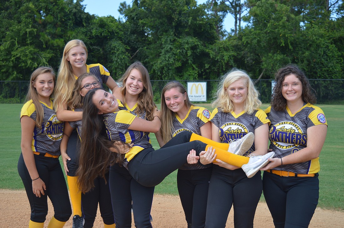 The 16U Lady Panthers pose for a fun team photo. Left to right: Katie Reahl, Kenzie Klisz, Sara Fosson, Payton Bryan, Casey Fagerstrom, Caitlyn Tatum, Kathleen Clifton, Rachael Norwood. Photo by Tim Briggs.