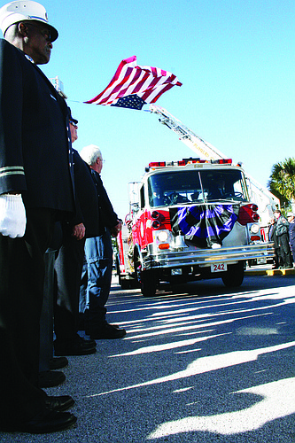Frederick Gleissner's casket was carried to St. Elizabeth Ann Seton Church Tuesday, Dec. 7, in a fire engine. PHOTO BY BRIAN MCMILLAN