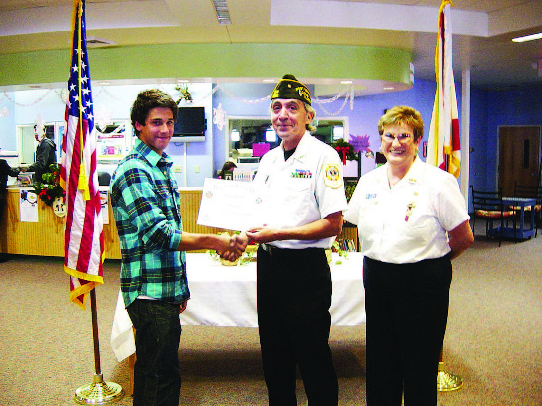 Student winner Brett Swartz, VFW Post 8696 Commander Steve Reginbald and VFW Women's Auxiliary Contest Chairperson Pat Donnelly. COURTESY PHOTO
