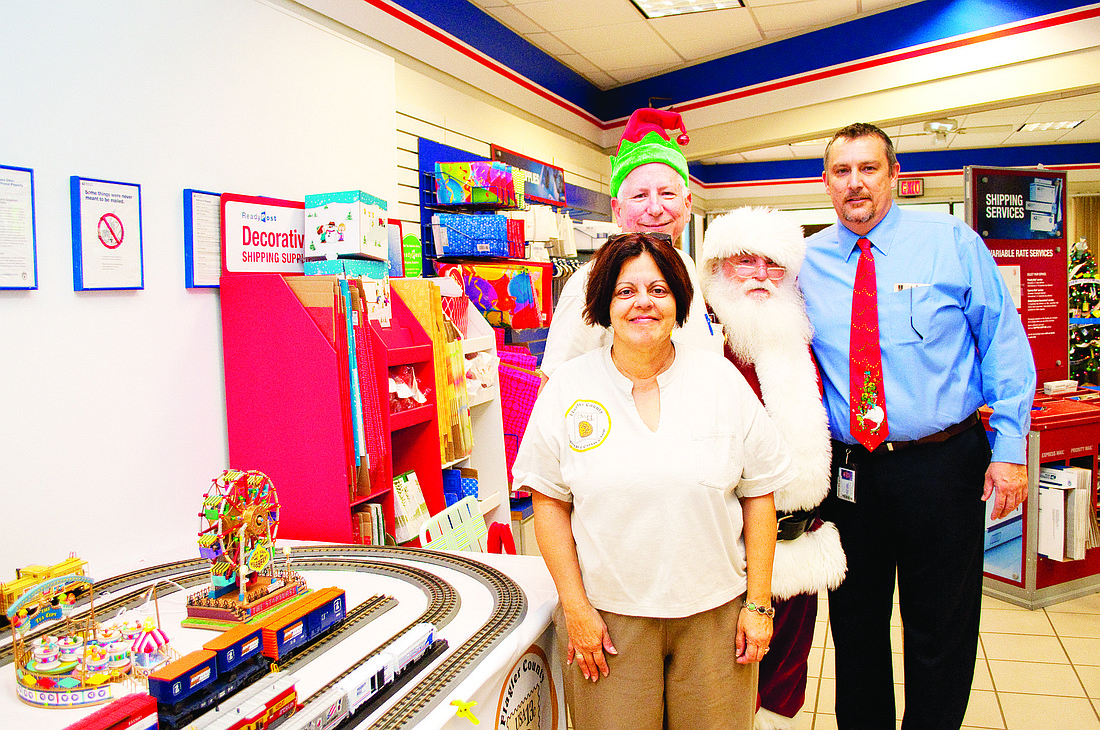 Sylvia and David Rosenthal, Santa and William Spangler. PHOTO BY SHANNA FORTIER