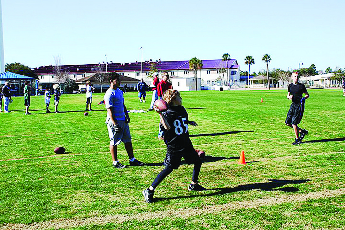 Evan Gentry, 10, competes in the punt, pass and kick contest Jan. 8, on registration day of the new Phantom Flag Football league. COURTESY PHOTO