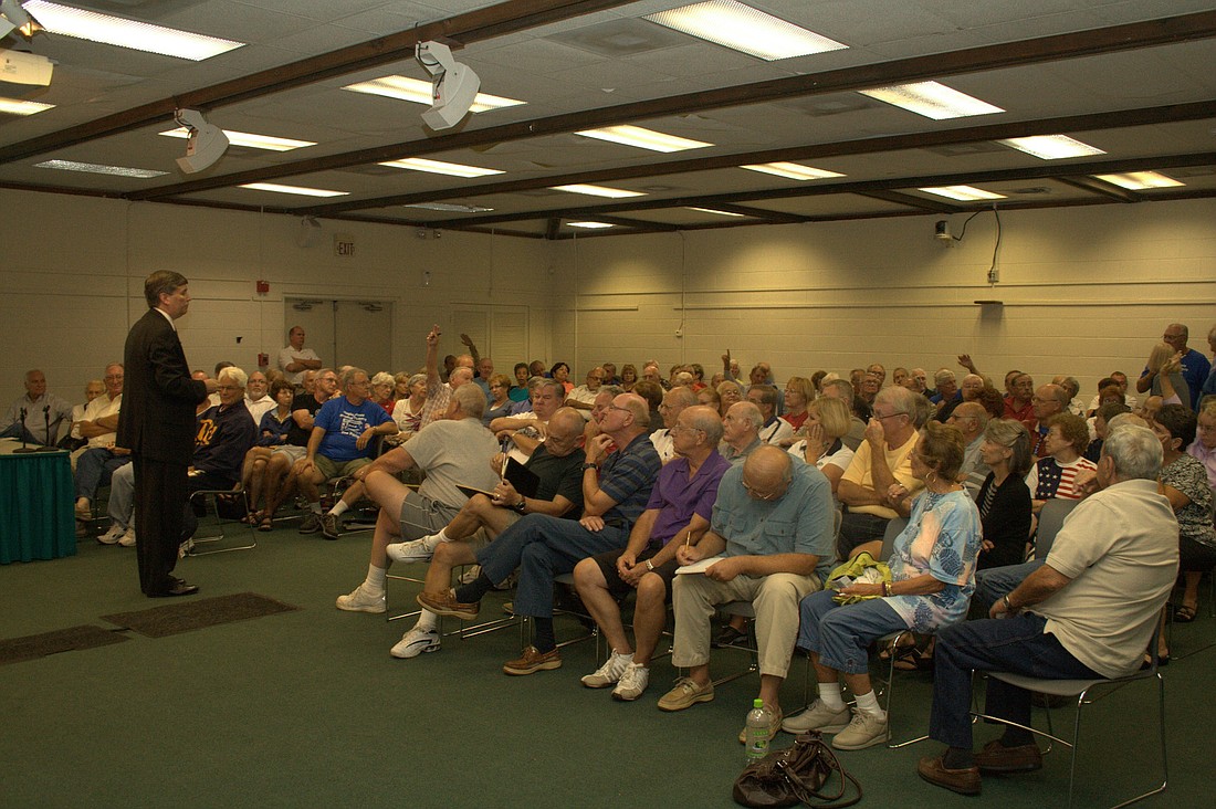 The crowd of nearly 200 residents at the Nov. 4 town hall meeting expressed displeasure with not having a vote in regard to the proposed Palm Coast City Hall. PHOTO BY ANDREW O'BRIEN