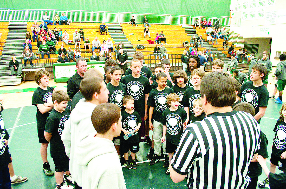 Members of the Bad Boy youth wrestling club acted as the honorary captains Wednesday, Jan. 26, at the FPC vs. University varsity match. PHOTOS BY SHANNA FORTIER