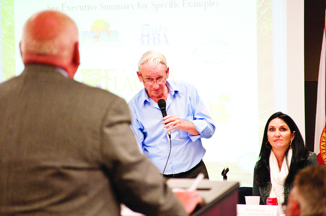 County Commission Chairman Alan Peterson specifically asked Palm Coast Mayor Jon Netts if the city supported imposing a tax. Netts said there is no consensus in Palm Coast to support a tax. PHOTOS BY BRIAN MCMILLAN