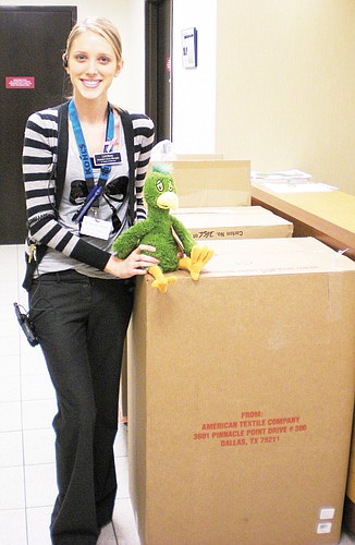 Lindsay Frilling, Kohl's assistant store manager, assists with the donation to Florida Hospital Flagler. COURTESY PHOTOS