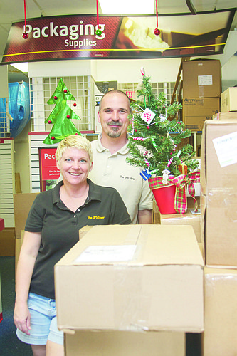 Wendy and Jerry Eggert said their Monday shipping volume triples in December, compared to the rest of the year. They've owned The UPS Store for 11 years. PHOTO BY BRIAN MCMILLAN