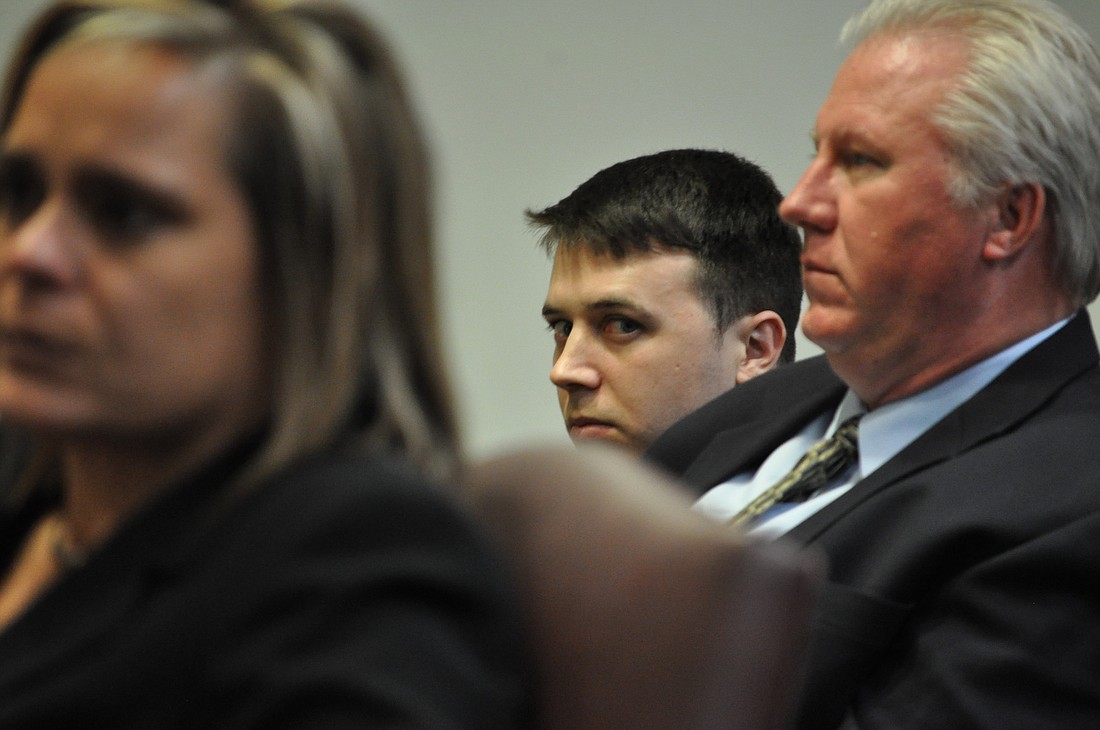 William Gregory sits with his attorney, Garry Wood, and across the room from the prosecutor, Jacquelyn Roys.