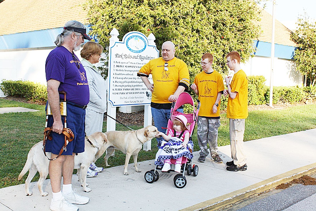 Wayne and Cathy Guile, with dogs A.J. and Destinee, and Brett, Killian, Gage and Tyler Korkes. COURTESY PHOTO