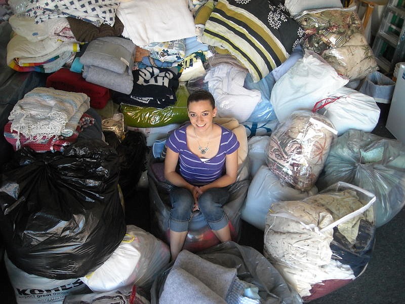 Alayne McDonald, shown here with the results of the blanket drive, has a brother stationed in Japan, in the U.S. Navy.
