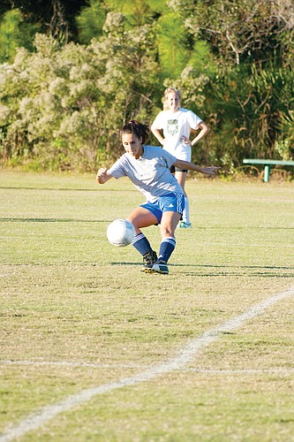 Ashley McGlashen keeps the ball in front of her Nov. 9, at practice. PHOTO BY SHANNA FORTIER