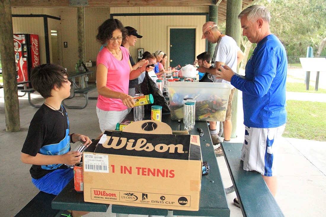 Residents help cut and label microfilament bins. Photo by Nichole Osinski