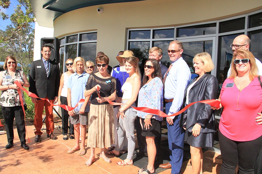 Chamber members, the Culler family and Halifax officials during the ribbon cutting. Photo by Nichole Osinski