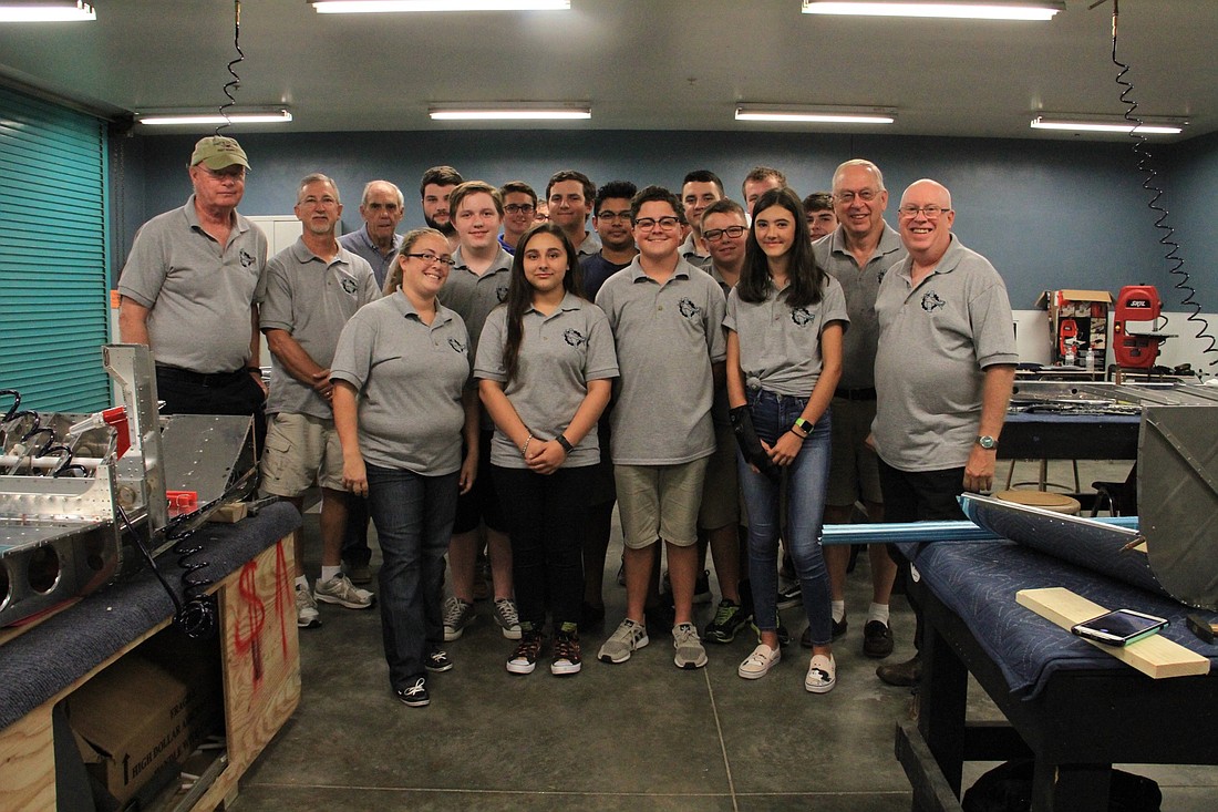 Aerospace Academy Director Samantha Harrison with class mentors and students. Photo by Nichole Osinski