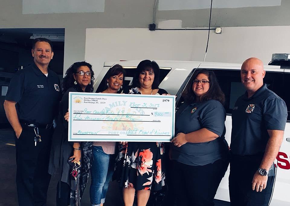 Chief Ken Fustin, Emergency Management Coordinator and Public Education Specialist Jordan Guido, Battalion Chief Bryan Smith with members of the Port Orange Community Trust. Photo courtesy of the Port Orange Fire Department