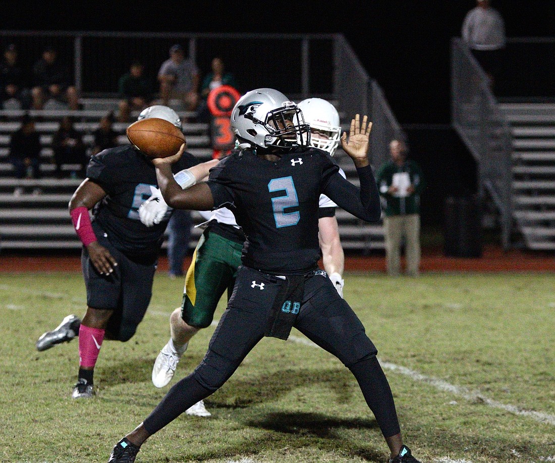 Rio Goodwin attempts a pass against Melbourne Central Catholic. Photo by Ray Boone