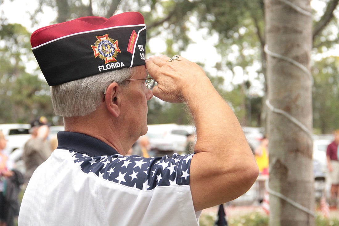 A veteran salutes during the Port Orange Veterans Day celebration. Photo by Nichole Osinski