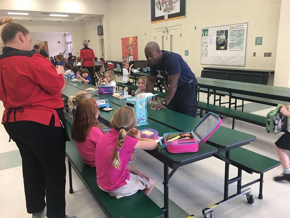 Ricardo Francois with students during lunch. Photo courtesy of the Port Orange Fire Department