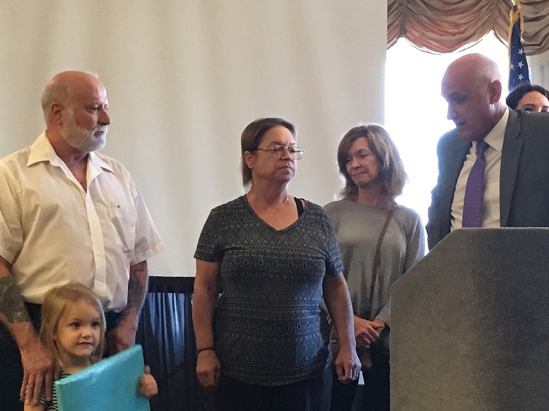 Timothy and Carol Rivers with their attorney Phil Peterson and Abagail Rivers. Photo courtesy of the 7th Judicial Circuit of Florida