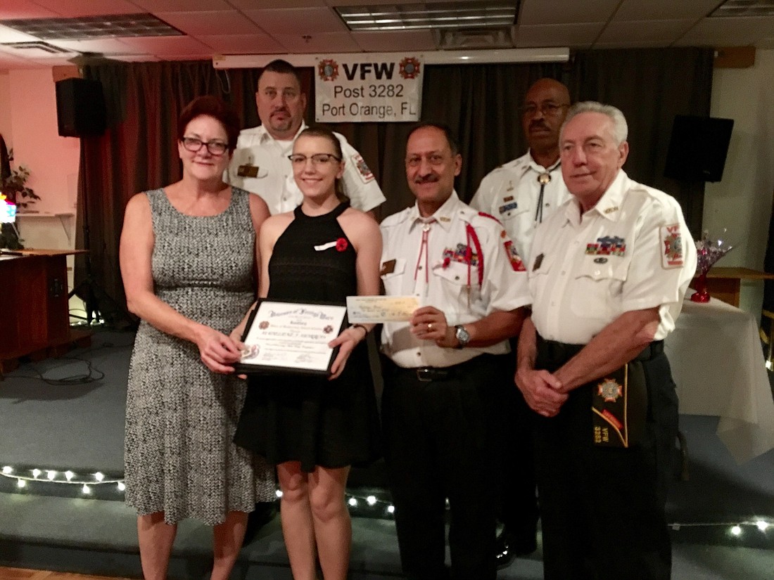 Jane Lilyander, president of the auxiliary,  Jimmie Adams, senior vice, Madeliene Morrow, Jose "Joe" Rosa, VFW commander, Larry Covington, chairman of the board, and Rod Phillips. Photo by Nichole Osinski