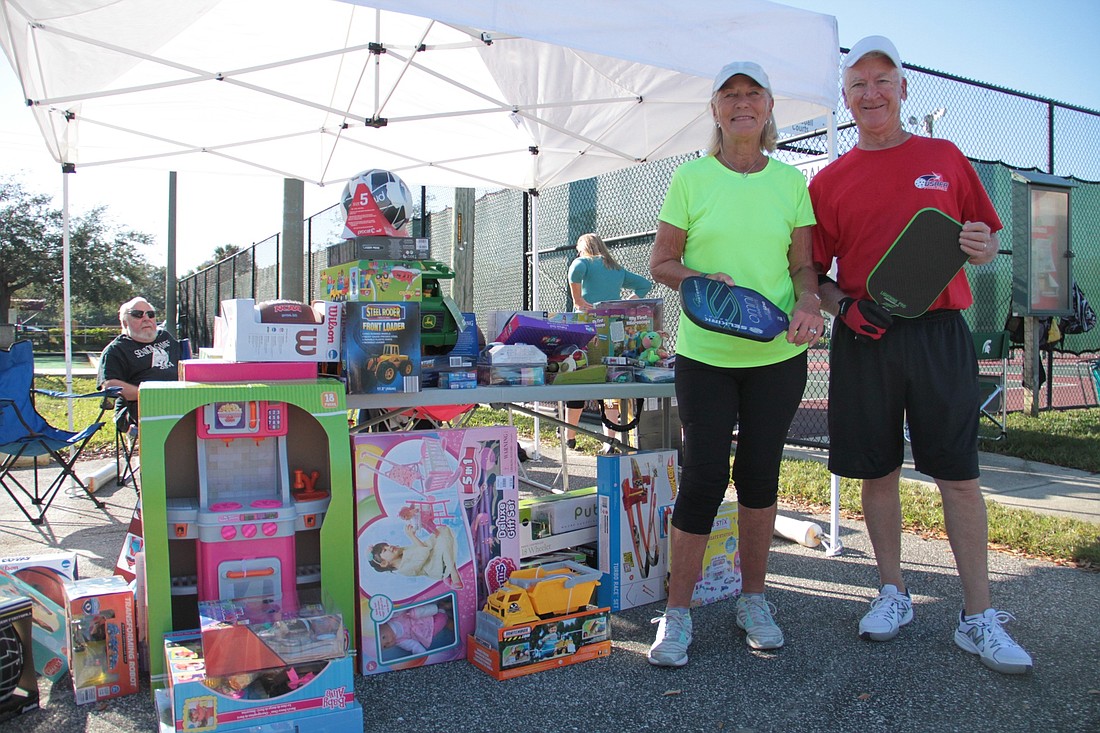 Edie Fragner and Harold Wheeler with toys that were donated. Photo by Nichole Osinski