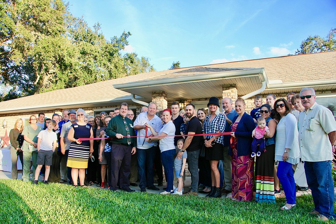 James and Christy Richard cut the ribbon with Mayor Don Burnette. Photo courtesy of James Richard and Christy Richard