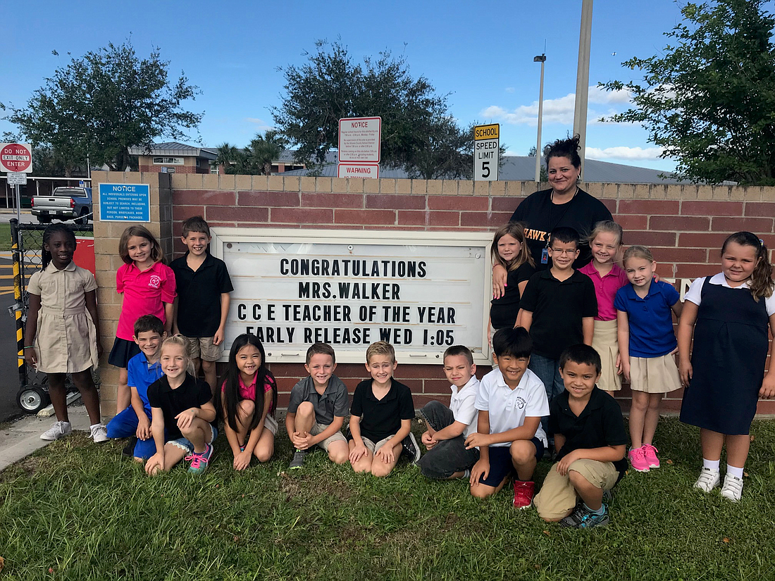 Second grade teacher Sofia Walker with Cypress Creek Elementary School students.  Photo by Nichole Osinski