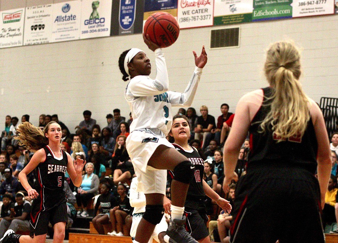 Atlantic point guard Shakawanza Brown shoots a floater against Seabreeze. Photo by Ray Boone