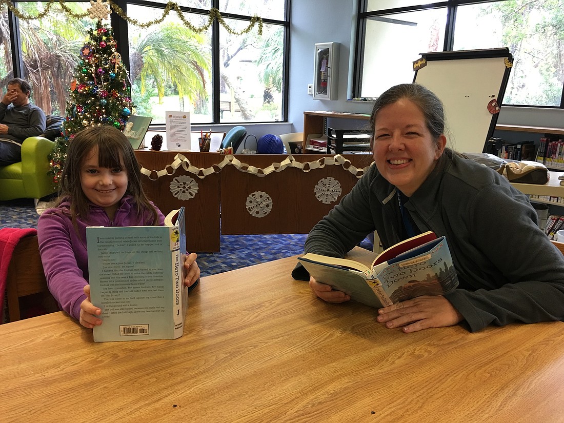 Zoey Tilman and Laura Armstrong, youth services librarian. Photo by Nichole Osinski