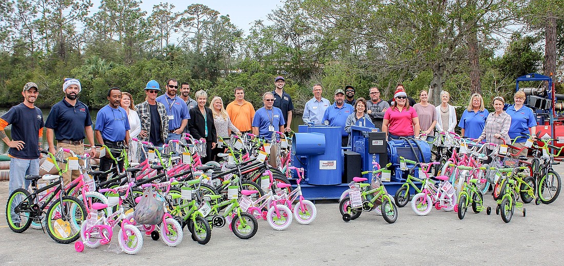 Thompson Pump employees donated 52 bicycles and helmets to Toys for Tots. Courtesy photo