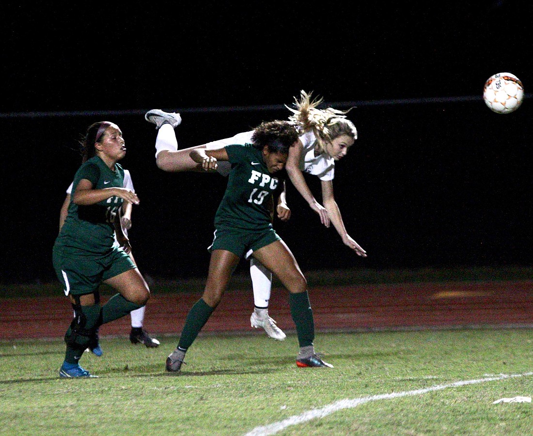 Spruce Creek's Jordan Di Verniero heads a ball against FPC. Photo by Ray Boone