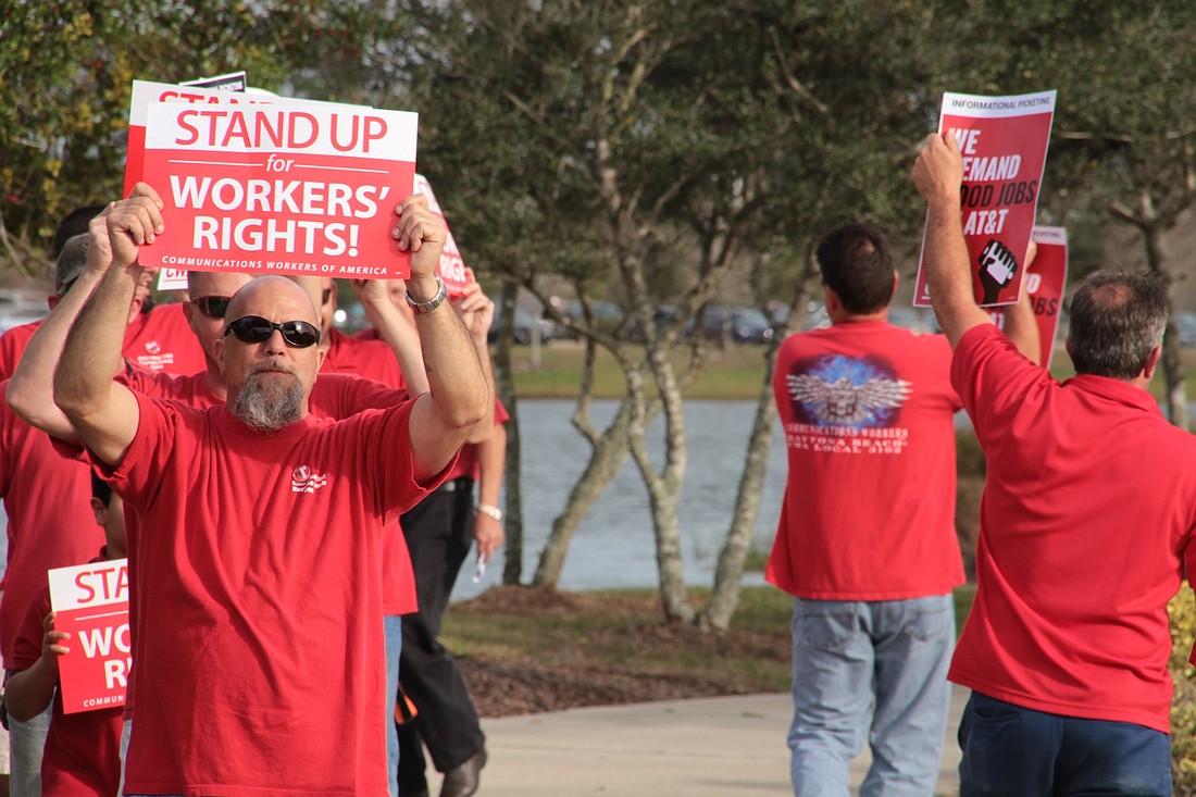 AT&T communications workers and union members protested at The Pavilion on Friday, Feb. 9. Photo by Nichole Osinski