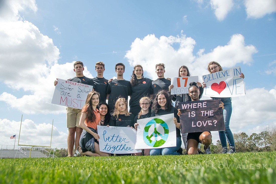 Spruce Creek students hold signs during a Unity Walk. Photo courtesy of Wilson Kowaleski