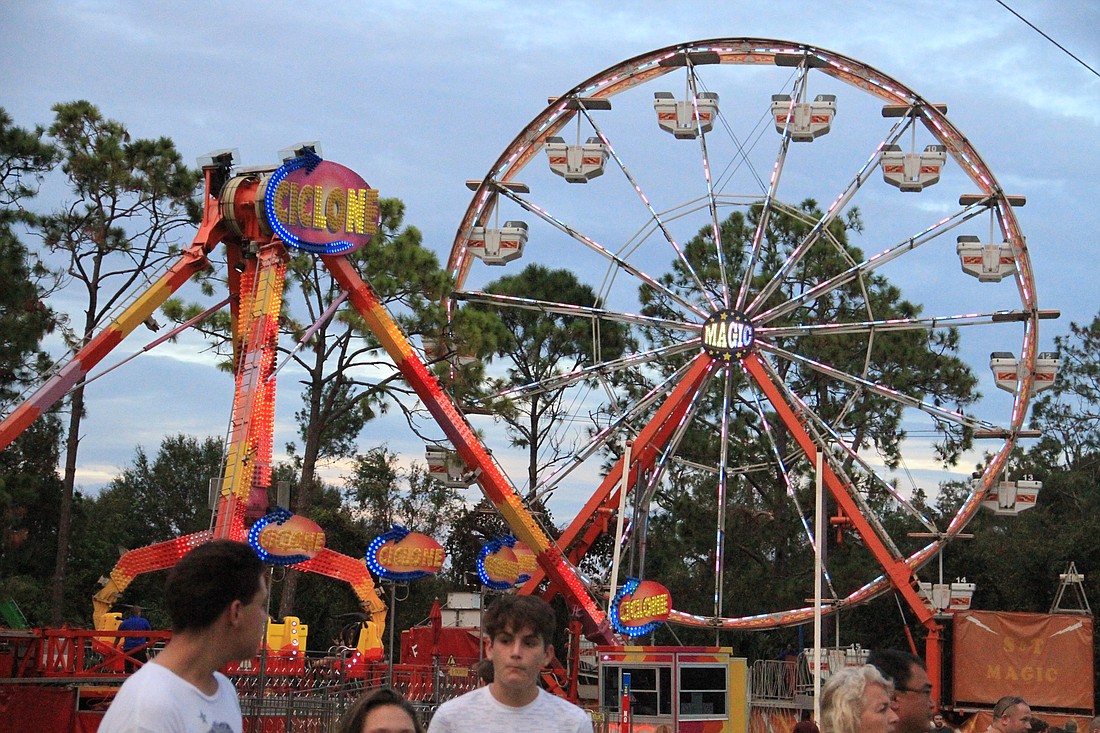 Residents can try different dishes and enjoy rides at the 2018 Spring Food Festival. Photo by Nichole Osinski