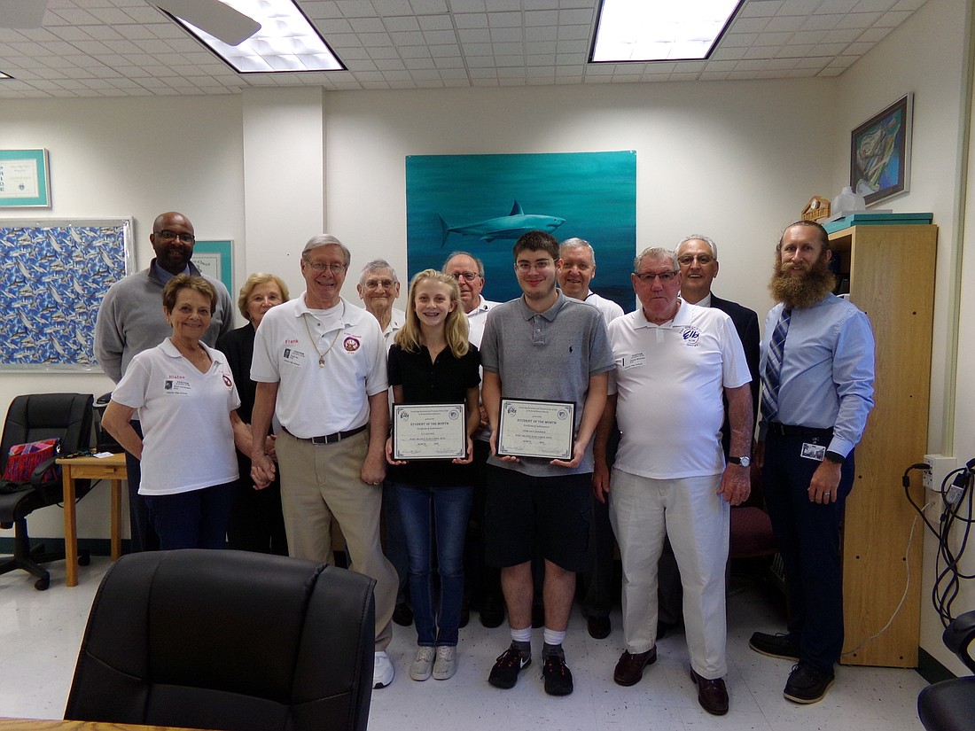 Principal Steven Hinson, Louise Lauthain, Ivy Gentry, Terry Doerrer, Brian Eschen, teacher on assignment, Paul Leonard and members of the Port Orange Elks Lodge #2723. Photo courtesy of the Port Orange Elks Lodge