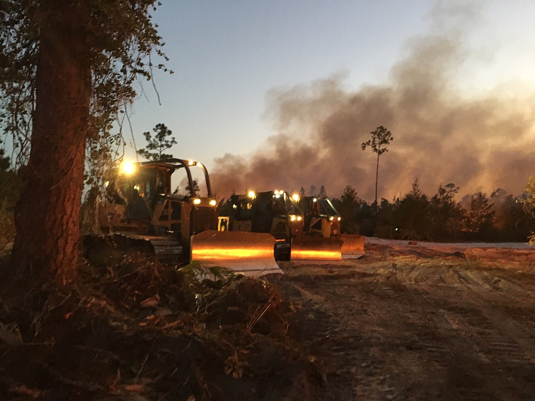Crews battle a fire that covered 204 acres. Photo courtesy of Florida Forest Service