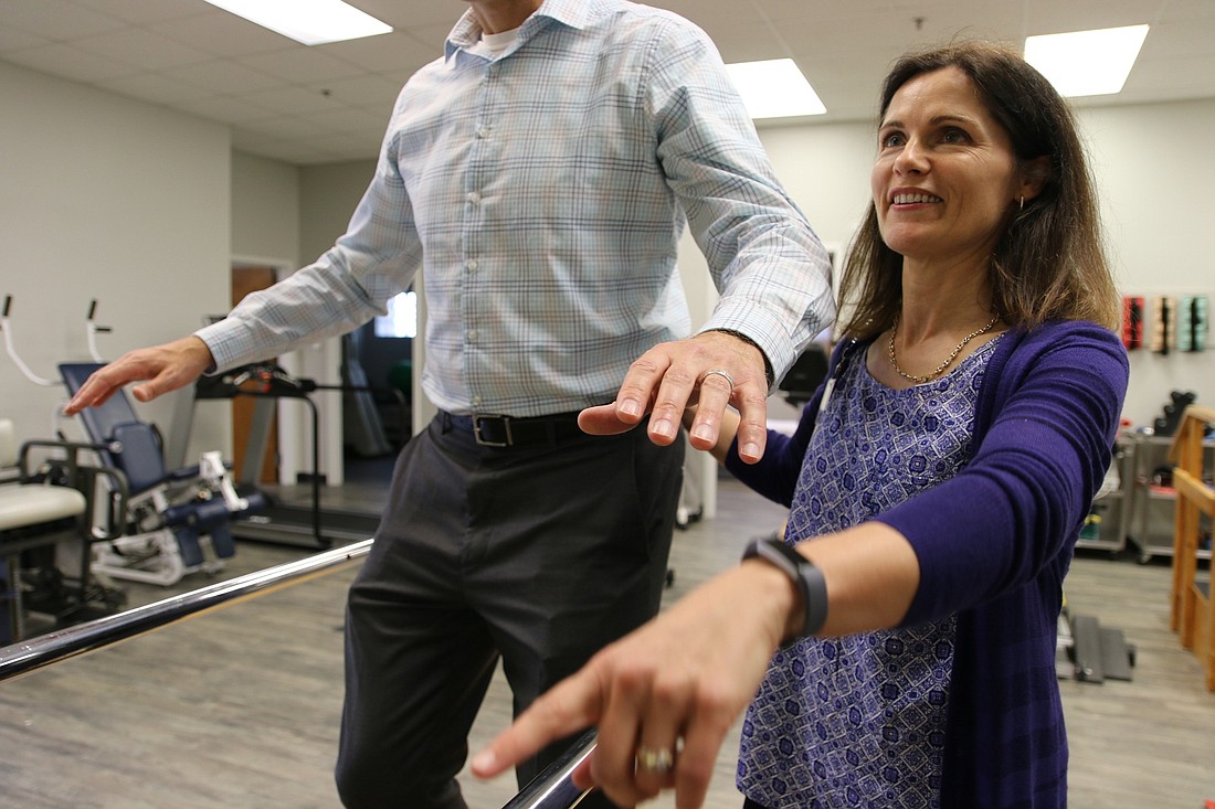 Halifax Health Port Orange Physical Therapist Laura Muller demonstrates a rehabilitation session. Photo by Nichole Osinski