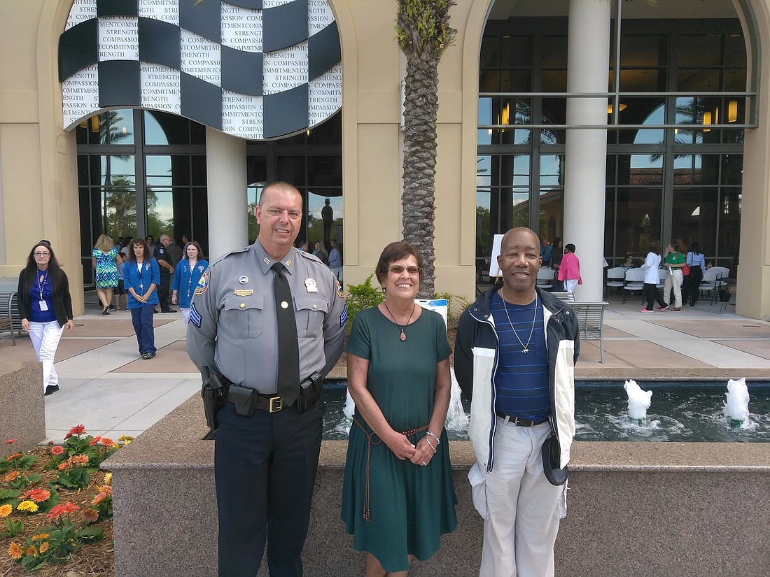 Daytona Beach Police Sergeant Raymond Ousterman, Debra Morgan and Anthony Richards. Photo courtesy of Halifax Health