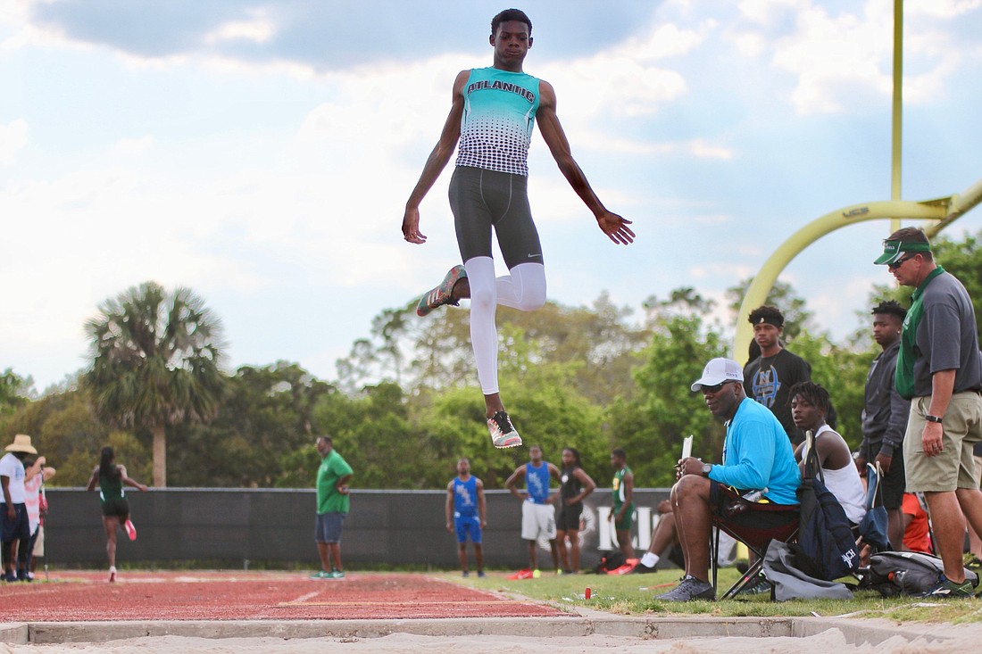 Atlantic's David Long does the long jump in the conference meet. File photo