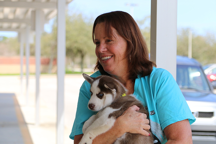 Sophie's Circle Founder Kathy Blackman with a rescue puppy. Photo by Nichole Osinski