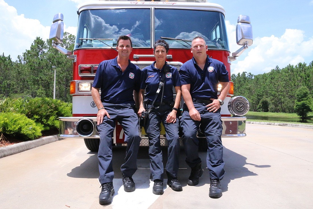 Joe LaFonde, firefighter and paramedic, Lt. Norma Bivens and Pete Robertucci, driver, engineer and paramedic. Photo by Nichole Osinski