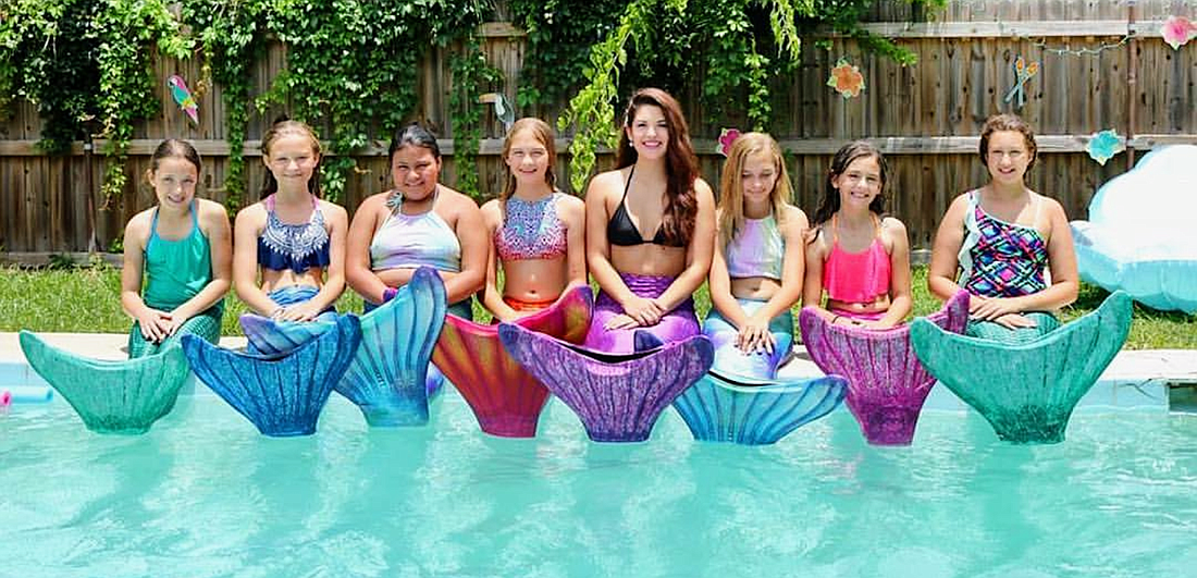 Young girls with their own mermaid tails at a party. Photo courtesy of Mermaid Adventures