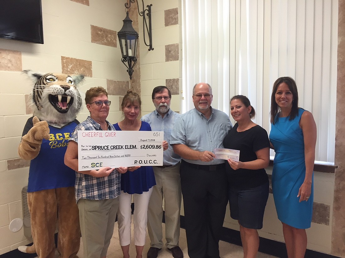 Bobby the Bobcat, Kathy Cratin, Peggy Wiggins, Hal Francis, Pastor Glenn Rice, Guidance Counselor Tina Howard and Principal Andrea Hall. Courtesy photo.