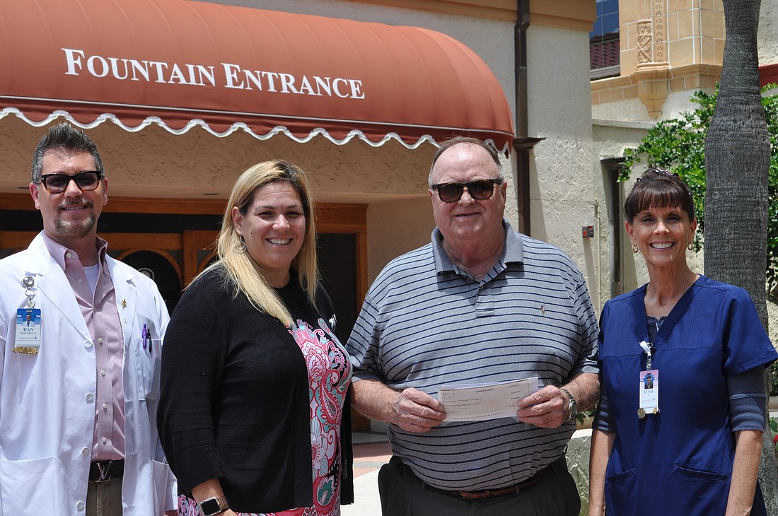 A Halifax nursing group donated $250 to Palmetto House. Shown are Dan Elko; Nicole Smith; Michael Coleman, program manager, Palmetto House; and Susie Johnsen. Courtesy photo