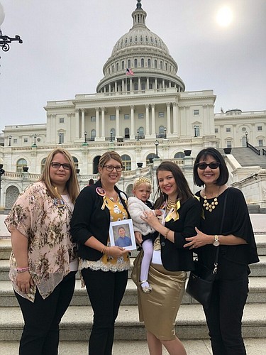 Laurie Parker, left, Jamie Franzini, Eleanor Stephens, Sarah Stephens and Carol Wickham stand at the United States Capitol in Washington, D.C. to raise awareness and funding for pediatric cancer. Courtesy photo.