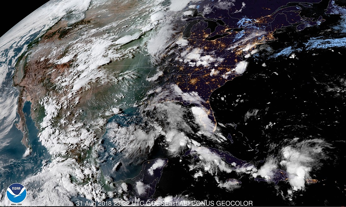 The tropical wave north of the Dominican Republic is expected to bring thunderstorms to Florida during Labor Day weekend. Photo courtesy the National Weather Service.