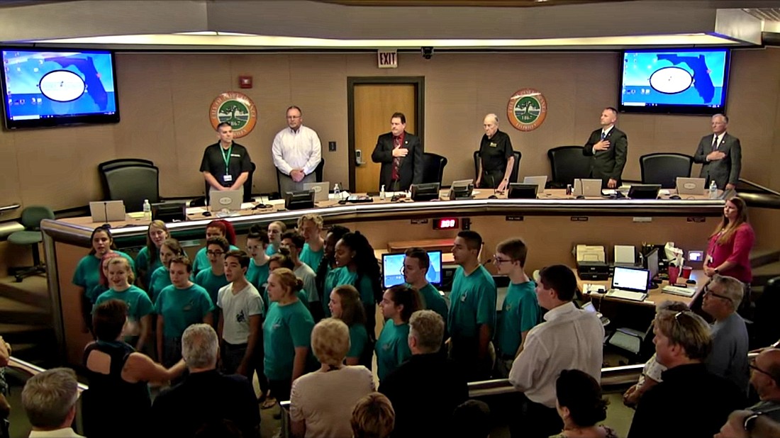 The Atlantic High School choir performs the National Anthem at a Port Orange City Council meeting.