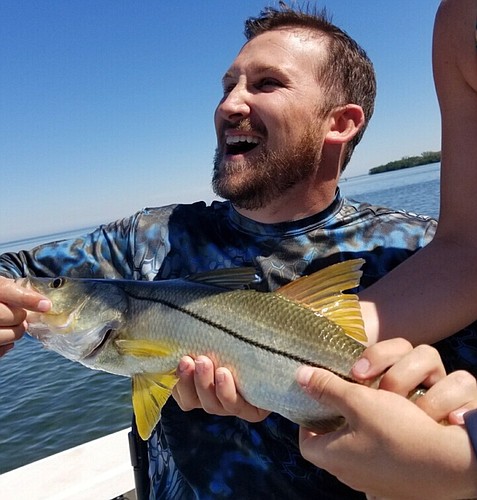 Kirk Crandall reels in a snook. Therapy helped him regain strength after he was paralyzed from the neck down in a car accident. This was the first fish he reeled in since regaining his strength. Courtesy photo