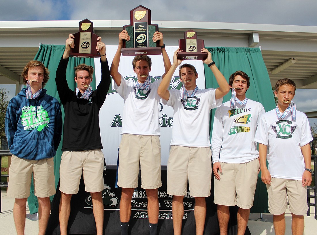 The boys' cross country team wins the first state title for a boys' program at Father Lopez. Photos by Jeff Dawsey